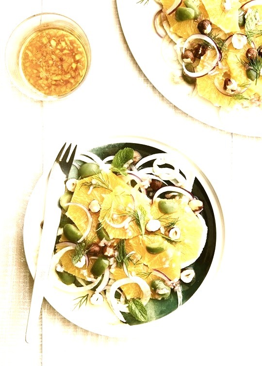 Orange, Fennel and hazelnut salad with green olives and fresh herbs Photographer